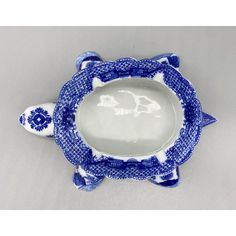 a blue and white plate with an animal design