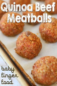 quinoa beef meatballs on a baking sheet with chopsticks in the background