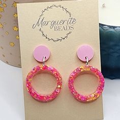 These Pink round earrings are the perfect set of earrings for everyday wear. They are made from Resin and Glitter. They would make the perfect gift for someone special. Please note - The glitters and colours in the earrings maybe different slightly from the photos because of lighting ect but i do my best to make sure they are very similar. If you have any questions, please message me. Happy shopping OTHER INFORMATION Shipping: Domestic Shipping will take 1 to 6 days - Express Shipping is available at an extra cost. International Shipping will take 6 to 10 Business Days - Express Shipping is available at an extra cost. Items can be posted within 14 Days Personalised Orders: Custom orders are not returnable, refundable or exchangeable due to their personalised nature. Colour: Actual colour m Pink Round Earrings For Birthday, Pink Round Birthday Earrings, Pink Circular Nickel-free Jewelry, Handmade Round Earrings For Birthday, Handmade Pink Circular Earrings, Handmade Pink Circle Earrings, Pink Circle Earrings As A Gift, Pink Circle Earrings For Gift, Pink Circle Earrings For Gifts