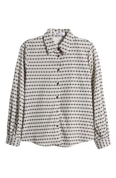 An eye-catching geo print emboldens this desk-to-dinner shirt. Spread collar Long sleeves 100% polyester Hand wash, dry flat Made in the USA Long Sleeve Shirt With Geometric Pattern For Work, Long Sleeve Tops With Geometric Pattern For Work, Long Sleeve Geometric Pattern Blouse For Work, Elegant Long Sleeve Tops With Geometric Pattern, Elegant Long Sleeve Top With Geometric Pattern, Modern Geometric Pattern Shirt For Workwear, Modern Shirt With Geometric Pattern For Workwear, Modern Workwear Shirt With Geometric Pattern, Geometric Pattern Blouse For Workwear