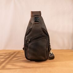 Crazy Horse Leather Chest Bag for Men's Leisure Retro Style Crossbody Bag Top Layer Cowhide Shoulder Bag Commuter Outdoor Leisure Bag PRODUCT INFORMATION --------------------------------------------- --Product Size: 34x9x17 cm--13.38x6.69x3.54 inch; --Item Weight:0.6 kg/1.32lb --Color: Deep Brown --High-Quality Stitching This bag has an adjustable shoulder strap. On the back of the crossbody bag are two hooks for both the left and right shoulders FEATURES ----------------------------------------------- The leather shoulder bag exudes an irresistible charm with its timeless design and exceptional craftsmanship. Carefully constructed by skilled artisans, this bag embodies the perfect blend of functionality, durability, and unparalleled style. Crafted from 100% first layer cowhide, this cross Portable Shoulder Bag Backpack For Outdoor, Leather Crossbody Chest Bag For Outdoor Activities, Brown Chest Bag With Zipper For Outdoor, Brown Chest Bag With Zipper Pocket For Outdoor, Leather Chest Bag With Adjustable Strap For Outdoor, Brown Crossbody Chest Bag For Outdoor, Brown Portable Chest Bag For Outdoor, Rectangular Outdoor Chest Bag With Anti-theft Pocket, Outdoor Large Capacity Brown Chest Bag