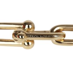 This Tiffany & Co Hardwear Medium Link Bracelet XL is in yellow gold hardware with diamonds, featuring medium sized links, two yellow gold links encrusted in 0.9 ct pavé diamonds, with a total carat weight of 1.39 and has a hook and clasp closure.Origin: ItalyCondition: New and never wornAccompanied by: Tiffany box, Tiffany jewelry boxMeasurements: bracelet circumference: approximately 7.75"; diameter: 2.5" Luxury Oval Link Bracelets With Polished Finish, Luxury Oval Link Bracelet With Polished Finish, Luxury Link Bracelets For Formal Occasion, Formal Yellow Gold Bracelets With Hook And Links, Formal Gold Chain Bracelet With Hook And Links, Formal Gold Bracelet With Links, Designer Yellow Gold Chain Bracelet For Formal Occasions, Luxury Yellow Gold Chain Bracelet With Hooks And Links, Luxury Chain Bracelet With Rectangular Links And Hooks