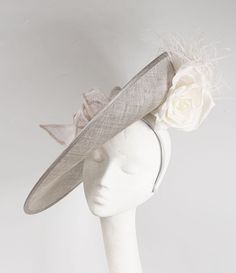 READY MADE FOR DISPATCH A mid grey sinamay hat with an upturned brim, trimmed with gorgeous silk flowers, feathers and sinamay loops. secured with a narrow fabric covered headband. Mother Of The Bride Hats, Hat Tea Party, Sinamay Hat, Ss 2024, Royal Ascot Hats, Occasion Hats, Sinamay Hats, Ascot Hats, Bride Hat