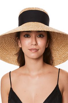 Eugenia Kim mirabel hat in natural/black. 100% Straw Spot Clean Made in China Chic Black Toquilla Straw Hat, Black Toquilla Straw Panama Hat For Spring, Black Panama Hat In Toquilla Straw For Spring, Black Wide Brim Panama Hat, Black Summer Visor Hat, Elegant Black Straw Sun Hat, Black Toquilla Straw Sun Hat With Short Brim, Black Brimmed Toquilla Straw Sun Hat, Chic Black Wide Brim Panama Hat