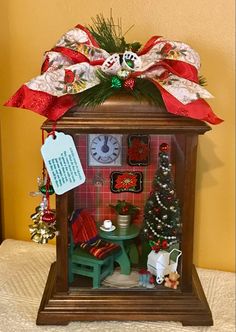 a small christmas clock with decorations on it