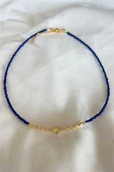 Basic Description: Great simple piece for every occasion. Handmade assorted navy seed beaded necklace. Very lightweight and dainty. Necklaces are joined with a lobster-style clasp and two inch extended chain.  Sizing:  Each necklace is made with a two inch extender chain so the size can be adjusted to your liking. For example, the 16 inch necklace can be extended up to 18 inches. Care: While necklaces will not be damaged by moisture, avoid getting your necklace wet to prevent potential fading or Blue Necklace Beads, Seed Beaded Necklace, Birthday Sleepover Ideas, Simple Beaded Necklaces, Dainty Necklaces, 16 Inch Necklace, Blue Beaded Necklace, Seed Bead Necklace, Blue Necklace