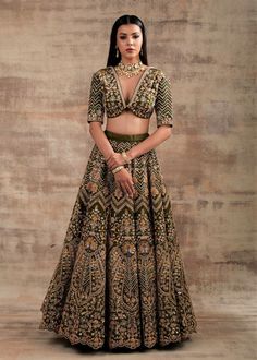 Choose a royal touch with this Pesto Green lehenga Shringarmati from Jannat Collection Are you struggling with the thought of what to wear on your special occasions? Look no further than this super-stylish pesto green color lehenga. This outfit is the game-changer that looks regal, royal and splendid. The most impressive thing about this lehenga is that it looks heritage, traditional and glamorous at the same time. Pepped up with Dori and gotta embroidery work, this lehenga will make you look li Raw Silk Meenakari Choli For Receptions, Fitted Meenakari Lehenga For Reception, Elegant Sharara With Meenakari For Reception, Fitted Traditional Wear With Meenakari For Reception, Elegant Fitted Traditional Wear With Meenakari Details, Elegant Fitted Traditional Wear With Meenakari, Anarkali Wedding Dress With Meenakari Detailing, Anarkali Meenakari Wedding Dress, Elegant Fitted Sharara With Meenakari