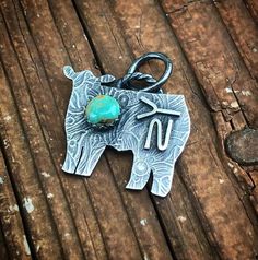 This listing is for one (1) .925 sterling silver animal charm with a genuine Kingman turquoise stone. The charm measures roughly 1" wide. This charm comes on an 18" .925 sterling silver chain.&#9728 !!!PLEASE LEAVE TWO RELIABE FORMS OF COMMUNICATION IN THE DESCRIPTION BOX INCASE I NEED TO CONTACT YOU ABOUT YOUR ORDER!!! &#9728CLEANING:     To clean your pieces, gently wipe them with a polishing cloth. Using chemicals is not recommended. I also offer complimentary cleaning, and/or antiquing (not Personalized Western Silver Jewelry, Personalized Western Style Silver Jewelry, Personalized Silver Western Jewelry, Rustic Sterling Silver Engraved Jewelry, Rustic Engraved Sterling Silver Jewelry, Rustic Sterling Silver Pendant Jewelry, Western Style Silver Turquoise Necklace As Gift, Turquoise Sterling Silver Jewelry With Charms, Western Style Pendant Jewelry For Gift