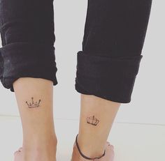 two people with matching tattoos on their feet, one has a crown and the other has a heart