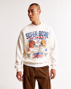 Step into the realm of nostalgia with the Abercrombie & Fitch Men's Vintage Super Bowl Graphic Crew Sweatshirt. Perfect for the sports enthusiast with a taste for retro style, this sweatshirt is a standout piece in any casual wardrobe.

- Size: XL TALL
- Color: White
- Material: Cotton, Polyester blend
- Gender: Male
- Features: Crew neckline, banded hem and cuffs, vintage Super Bowl-inspired graphic on the chest

Crafted from our exceptionally softAF fleece fabric, this oversized-fit sweatshirt White Oversized Varsity Sweatshirt, Oversized White Varsity Sweatshirt, Retro Relaxed Fit Crew Neck Sweatshirt, White Graphic Print Sweats For Streetwear, Collegiate Crew Sweatshirt With Graphic Print, Varsity Style Crew Neck Sweats With Graphic Print, Varsity Style White Sweatshirt With Graphic Print, Sports Season Embroidered Sweatshirt For Streetwear, Collegiate Graphic Print Crew Neck Sweats