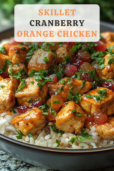 an orange chicken dish with white rice and garnish