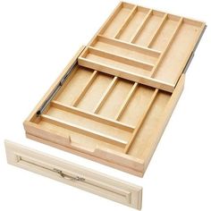 the drawer is open and has drawers on each side, which are divided into separate sections