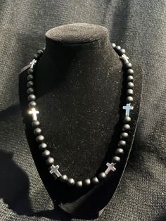 Grab this custom Blackout all Black inspired beaded necklace.  All matte black Beaded Necklace with Silver Crosses!  w/ magnetic clasp for easy and comfort. 18-20in Colors of the Sea! Elevate your style AND your game with our vibrant, handcrafted beaded necklace.   Look Good, Feel Good, Feel Good Play Good! BLING BLING ⚾️🏈⚽️🏀⚾️️ 📿 Baseball Football Soccer Softball Basketball 🌟 Features: 🌟 Unique Design 💎 Quality Matters: Thick Elastic band and magnetic clasps ensure durability and long-las Jose Alvarado, Black Inspiration, White Cross, Black Bead Necklace, White Crosses, Bead Chain, Onyx Stone, Silver Cross, Magnetic Clasp