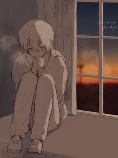 a person sitting on a window sill looking out at the sunset