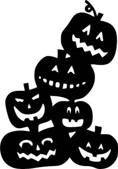 three pumpkins stacked on top of each other with faces carved into them, all in black and white