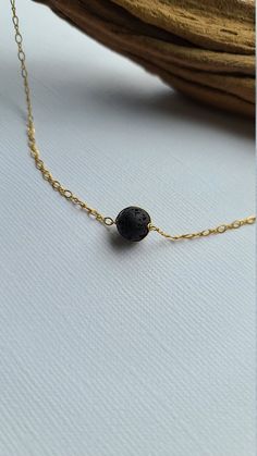 "Pele's Choker Necklace You can customize this black lava necklace to suit your personal style with your choice of sterling silver, 14k gold filled or 14k rose gold filled material. The model is wearing the 15\" length chain. D E T A I L S * Lava Bead Size: Approx 8mm * Chain Length: 14\" to 20\" For use with essential oils, add a drop or two of your favorite 100% pure therapeutic grade essential oil on to the lava beads, allow it soak in and enjoy the aromatherapy! Lava rocks are very porous an Adjustable Hypoallergenic Black Necklace, Minimalist Adjustable Lava Stone Jewelry, Elegant Adjustable Lava Stone Jewelry, Everyday Spiritual Lava Stone Jewelry, Elegant Black Lava Stone Jewelry, Black Lava Stone Necklace For Gift, Adjustable Black Minimalist Charm Necklace, Black Adjustable Minimalist Charm Necklace, Black Hypoallergenic Necklace As A Gift