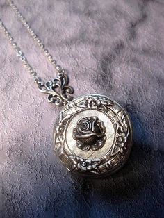 Silver Rose Locket Necklace The Locket measures 32mm round (1.25 inches round) Chain: - Silver Plated - YOU CHOOSE YOUR CHAIN LENGTH FROM DROP DOWN MENU TOOL ☻☻ TO see MORE of our LOCKET NECKLACEs (while supplies last): https://www.etsy.com/shop/FashionCrashJewelry/search?search_query=locket&order=date_desc&view_type=gallery&ref=shop_search ☻☻TO VIEW ADDITIONAL OPAL JEWELRY SELECTIONS: https://www.etsy.com/shop/FashionCrashJewelry/search?search_query=OPAL&order=date_desc&view Silver Round Pendant With Rose Design, Silver Necklace With Rose Design, Vintage Rose-colored Jewelry For Weddings, Vintage Rose Wedding Jewelry, Vintage Jewelry With Rose Design Flower Pendant, Adjustable Vintage Rose Jewelry, Vintage Rose Design Flower Pendant Jewelry, Vintage Rose Flower Jewelry, Vintage Rose Jewelry For Wedding