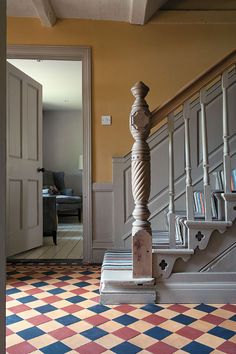 a stair case in the middle of a hallway