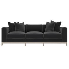 a black couch with pillows on it