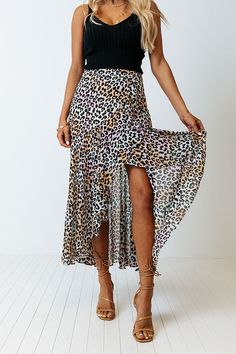 There is no better piece to make an outfit with than our pretty peach colored 'Only Sunshine' skirt featuring lightweight breezy material patterned with a black leopard print print, a high waistline, and a relaxed silhouette that falls into a high/low tulip hemline!                                         Measurements XS variant has  a Hip of 32",  a Length of 36",  a Slip Length of 16.5",  a Waist of 24".  S variant has  a Hip of 34",  a Length of 36.5",  a Slip Length of 17",  a Waist of 26". Make An Outfit, Leopard Skirt, Black Leopard Print, High Low Skirt, Black Leopard, High Low Dress, High & Low, High Low, Maxi Skirt