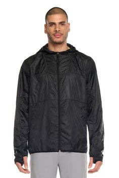 Made from lightweight polyester, this jacket is designed to keep you protected from the elements while being easy to pack away. The left side of the jacket features a zipper and contrast color while the right side is a printed reflective silver for added visibility in low light conditions. The jacket also comes with a left side zipper and a center front zipper. With its adjustable hood and elasticized cuffs, this jacket is both functional and stylish. Product Features: Lightweight Wind-resistant Left side zipper Center front zipper 2 side pockets Model Is Wearing Size M: Height - 1m80 - 5'11 Waist - 31 Wearing Jacket, Bra Dress, Black Camo, Cargo Pant, T Shirt Bra, Low Light, Windbreaker Jacket, V Neck Tops, Jogger Pants