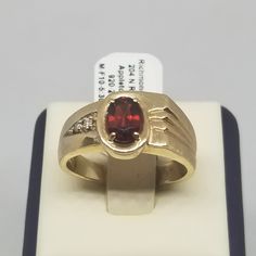 Vintage 10K Yellow Gold with Garnet & Diamonds Ring, Size 10.5. Stamped 10K Rogers inside band. Main stone is 7 x 5mm. Ring is 10mm wide. Weighs 3.3 dwt. We do not check prongs for wear or stones for looseness. All items are sold as is-noting that we are a resale shop so everything here had a previous owner! We will include flaws in the description when noted. This is one of the reasons our items are more affordable than new at a jewelry store. Are these stones real or fake? Aside from diamonds, we do not know if any gemstones are natural or synthetic. We will state on certain gemstones, that we know 100%, if they are created or fake due to their lack of inclusions. For this reason, we do not sell any diamonds without inclusions, and the larger diamonds (half ct+) are soft graded. In recen Collectible Oval Rings With Gemstone Accents, Gold Oval Signet Ring With Accent Stones, 14k Gold Polished Gemstones For Anniversary, 14k Gold Gemstones With Polished Finish For Anniversary, Gold Signet Ring With Accent Stones For Anniversary, Anniversary Gold Signet Ring With Accent Stones, Garnet And Diamond Ring, European Jewelry, Vintage Fine Jewelry