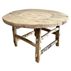 an old wooden table with two legs and a small round wood table top on white background