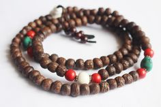 This is a Indian Bodhi Seed Mala with dark brown color Side cut.Its has been decorate with Naga shell and Red coral Beads. Handmade in Nepal. 11mm 108 beads 24inch long Necklace. Meditation Buddha Shop For Nepali handmade Products. We Supports Small Family Artisans who create a Beautiful handmade rituals Products. Spiritual Brown Beaded Bracelets For Rituals, Handmade Brown Beaded Bracelets For Ceremonial Use, Handmade Brown Beaded Bracelets For Rituals, Bohemian Beaded Bracelets For Puja, Bohemian Brown Mala For Rituals, Brown Bohemian Mala With 108 Beads, Bohemian Brown Mala With 108 Beads, Traditional Brown Mala For Meditation, Brown Bohemian Mala For Puja