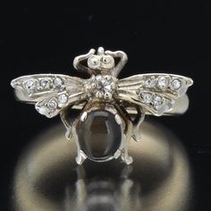 "Vintage Gold and Tiger's Eye and Diamond Bee Ring Size 5.5 14k white gold diamond & tiger's eye fly conversion ring. This ring was re-purposed from a vintage 14k pin and was welded to an antique 14k white gold ring shank . Total weight of 3.7 Grams. Fly portion of ring is approximately½\"L x¾\"W.less Condition: Metal content was tested with a Niton DXL spectral XRF analyzer. Ring is presented in very good overall condition with normal wear for age. (See magnified photos)." Eye Rings, Gold Tiger Eye, Antique Jewelry Rings, Bee Ring, Ring Shank, Ring Pictures, Eye Ring, 14k White Gold Ring, White Gold Ring