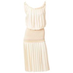 Laura Biagiotti, ivory silk, sleeveless, pleated dress, having a scoop neckline, and a blouson bodice. There is a knit fabric that starts at the waist and extends to the hip, creating a drop waistline. Sleeveless Silk Pleated Fitted Dress, Fitted Silk Sleeveless Pleated Dress, Laura Biagiotti, 1980s Fashion, Ivory Silk, Dropwaist Dress, Tennis Dress, Underworld, Rehearsal Dinner