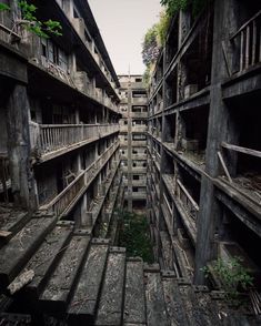 an abandoned building with lots of windows and balconies