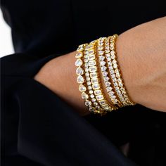 Feel elegant and empowered when you wear the Ella Tennis Bracelet. Featuring a gorgeous rectangle cubic zirconia pattern on an exquisite 18k gold plating. 18k gold plating Cubic Zirconia stones Dimensions: Up to 7 1/2" length Adjustable extra clasp (remove or add for length) Available in 6.5" and 7.5" Made to last Water and tarnish resistant Trendy Chokers, Nail Bracelet, Cubic Zirconia Bracelet, Wedding Jewellery Collection, Sunglass Chain, Bracelet Online, Gold Necklace Layered, The Grove, Scarf Jewelry