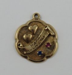 "This is a vintage \"Happy Anniversary With Blue & Pink Stones\" 10 karat gold charm for a charm bracelet.  It weighs 3.55 grams and measures 3/4\" x 7/8\", marked \"10K\" All charms come with a split ring to attach to a bracelet. We have hundreds of charms in stock. If you don't see what you are looking for in our shop please contact us as it is likely we have it. Inventory #G2295" 14k Gold Round Pendant Charms For Anniversary, Vintage Gold Bracelets For Valentine's Day, Yellow Gold Round Pendant Charm For Anniversary, Vintage Yellow Gold Charm Bracelet Gift, Heirloom Style Charm Bracelet With Vintage Charm As Gift, Yellow Gold Pendant Charms For Anniversary, Heirloom Vintage Charm Jewelry For Anniversary, Vintage Personalized Jewelry For Birthday, Personalized Vintage Jewelry For Birthday