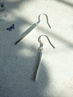 Dainty dangle earrings High polished sterling silver Perfect Earrings for Everyday Wear Size:Small, 1 5/8" total height Hook. Bar Measure 7/8" Long x 1/8" Wide 925S Stamp on Hook 925 Sterling Silver Bar Dangle Earrings. Skinny silver Bars. About 1.80 CM with out hook. Hook Closure with 925 mark stamp. Made of 925 Sterling Silver. Hypoallergenic Trendy Sterling Silver Earrings. Dainty, Light Weight Dangling Earring Dainty Dangle Earrings, Silver Bar, Earrings Dainty, Silver Bars, Bar Earrings, 925 Sterling Silver Earrings, Sterling Silver Earrings, Silver Earrings, Everyday Wear