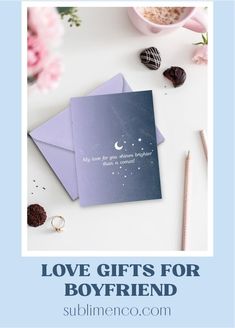 love gifts for him and her on top of a table with pink flowers, chocolates and