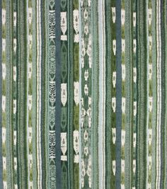 a green and white striped rug with many different designs on the top, bottom and bottom