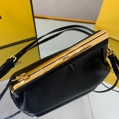 Description FND First Small Black For Women, Women’s HandBags, Shoulder And Crossbody Bags 10.2in/26cm FF 8BP129ABVEF0KUR Rep 1:1 Small FND First bag made of soft, black nappa with oversized metal F clasp with tone on tone nappa bands. Can be carried by hand as a clutch or worn on the shoulder thanks to the detachable shoulder strap. 26 x 9.5 x 18 cm / 10.2 x 3.7 x 7.1 inches (Length x height x width) Featuring an internal compartment lined in an iconic FF motif fabric Pull out internal attachme Womens Handbags, Luxury Products, Tone On Tone, One Bag, Fendi Bags, Soft Black, Bag Making, Monaco, Crossbody Bags