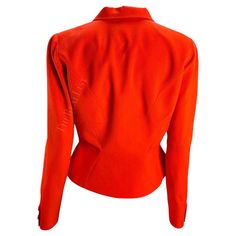 For Sale on 1stDibs - Presenting a fabulous bright orange Thierry Mugler blazer, designed by Manfred Mugler. From the 1980s, this jacket features masterful craftsmanship and Fitted Orange Blazer With Long Sleeves, Fitted Orange Blazer For Office, Orange Long Sleeve Formal Blazer, Orange Fitted Formal Outerwear, Formal Fitted Orange Outerwear, Elegant Long Sleeve Orange Blazer, Mugler Blazer, Blazer Designs, Thierry Mugler