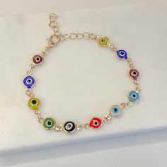 Evil Eye Bracelet, a mesmerizing piece that seamlessly combines style and protection. This evil eye charm bracelet, believed to ward off negative energy and protect its wearer.  ◆Plating : Gold ◆Size : Adjustable ◆Dainty, Simple, and Eye Catching ◆Length : 18cm + 5cm extension Packaging: All our jewellery comes in velvet bag or jewelry box Thank you so much for visiting our store enjoy shopping with us ❤️ Evil Eye Bracelet, Colorful Evil Eye Bracelet, Charm Bracelet, Protection Bracelet, Evil Eye Jewelry Multicolor Round Evil Eye Bracelets, Multicolor Evil Eye Round Bracelets, Spiritual Multicolor Evil Eye Bracelets, Multicolor Evil Eye Bracelets, Protection Bracelet, Evil Eye Charm, Evil Eye Bracelet, Velvet Bag, Evil Eye Jewelry