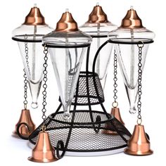 three copper - plated hummingbird feeders with clear glass covers and metal bells