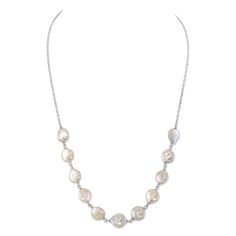 This beautiful pearl necklace would be the perfect gift for any occasion. The necklace features AAA Quality, 9.5-10.5mm various coin Freshwater pearls, hand picked for its gorgeous luster and overtones. The pearls are hanging on an 18 inch 925 sterling silver or Yellow Gold plated chain. All products come packaged in a beautiful jewelry box with a genuine cultured pearl guarantee. Affordable White Pearl Necklace With Round Pendant, Elegant Silver Coin Necklace For Anniversary, Elegant Coin Necklace With Pearl Pendant, Baroque Pearl Necklace For Anniversary, Mother Of Pearl Anniversary Pearl Necklace, Round Mother Of Pearl Necklace For Anniversary, Round Mother Of Pearl Drop Necklace, Mother Of Pearl Drop Necklace, Beautiful Pearl Necklace