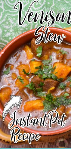 a red bowl filled with stew and vegetables