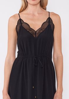 A new take on the classic little black dress, designed to blend timeless elegance with modern versatility. Featuring an adjustable cinched waist for the perfect fit, a delicate lace trim v-neckline and lace racerback. Lace trim Relaxed fit Adjustable cinched waist Sleeveless Mini length V-neckline Racerback detail Adjustable spaghetti straps Embrace the versatility and elegance of this boho chic mini dress, perfect for any occasion, from casual outings to sophisticated events. Model is 5'9, wear Black Spaghetti Strap Dress With Lace Closure, Black Dress With Lace Closure And Spaghetti Straps, Black Spaghetti Strap Dress With Delicate Lace, Chic Black Dress With Delicate Lace, Black V-neck Dress With Contrast Lace, Black Spring Dress With Lace Closure, Black Spring Dresses With Lace Closure, Black Dress With Lace Closure For Spring, V-neck Dress With Lace Bodice For Daywear