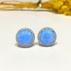 Sterling Silver Blue Opal & White Topaz Halo Earrings...Marked 925...Total of weights 3.5grams...Measure 12.8MM... These are in very good condition. Halo Earrings, Opal White, Blue Opal, Silver Blue, White Topaz, Jewelry Earrings Studs, Sterling Silber, Topaz, Halo