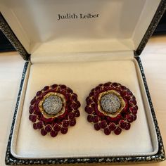 Judith Leiber Brand New Limited Edition Red Enamel Flower Earrings Approximate Measurements: Diameter 1.5” Excellent Condition Luxury Red Ruby Earrings, Luxury Ruby Earrings For Evening, Luxury Red Earrings For Party, Luxury Enamel Earrings For Anniversary, Luxury Red Earrings For Formal Occasions, Luxury Red Party Earrings, Red Enamel Clip-on Jewelry, Luxury Red Jewelry For Festive Occasion, Luxury Red Festive Jewelry