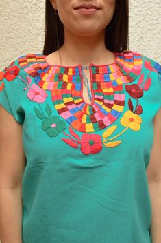 Magia Mexica Mexican Embroidered Blouses Women Blouse multicolored handmade by Mexican artisans. Measurements: ↕ 23 in ↔ 20 in WARRANTY We use what is needed to make your item arrives 100% safe and intact to your address. SHIPPING & DELIVERY TIMEFRAME We ship your order within 1-2 days after purchase USA: *Free Shipping USA 15-20 business days *Standard: 1 week * Express: 3 days Rest of the World: *Standard 4-6 weeks * Express: 5 days Every order is shipped within 1 business day Including IN Artisan Embroidered Summer Top, Artisan Embroidered Tops For Summer, Traditional Multicolor Embroidered Top For Fiesta, Multicolor Embroidered Festival Top, Multicolor Bohemian Embroidered Top For Fiesta, Multicolor Cotton Tops For Cinco De Mayo, Cinco De Mayo Multicolor Cotton Tops, Multicolor Tops For Cinco De Mayo Festival, Multicolor Top For Cinco De Mayo Festival