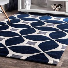 a blue and white rug in a living room