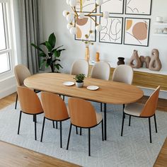 a dining room table with six chairs in front of it and pictures on the wall