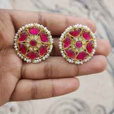 Pink flower kundan studs with pearls Material : 925 Hallmarked Silver Stones : Semi-precious pink and white kundans, fresh water pearls Diwali Kundan Pearl Earrings, Round Shape, Diwali Kundan Round Pearl Earrings, Kundan Pearl Earrings As Diwali Gift, Kundan Pearl Earrings With Stone Work For Gift, Diwali Round Kundan Pearl Earrings, Traditional Pink Jewelry With Dori Work, Fusion Style Kundan Pearl Earrings With Meenakari, Pink Kundan Jewelry For Puja, Kundan Pearl Round Earrings In Temple Jewelry Style