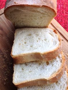 four slices of bread sitting on top of a cutting board